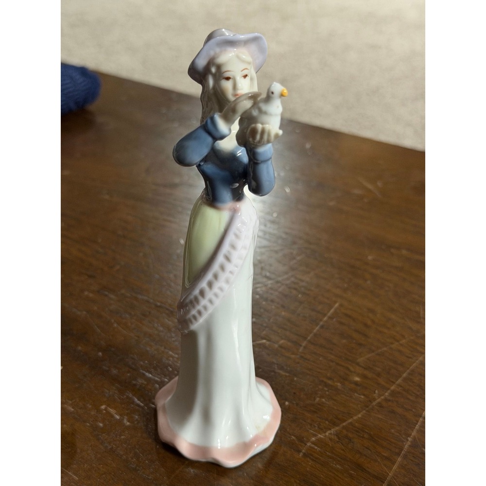 Porcelain lady bird dove figurine statue